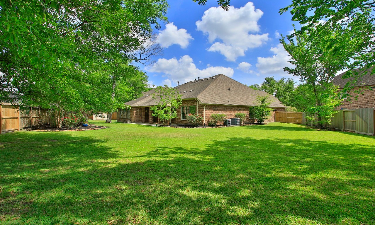 17711 Ravenno Lane Spring, TX 77379 - Photo 39 of 50 Mature shade trees and wide open space for pets and children to play.