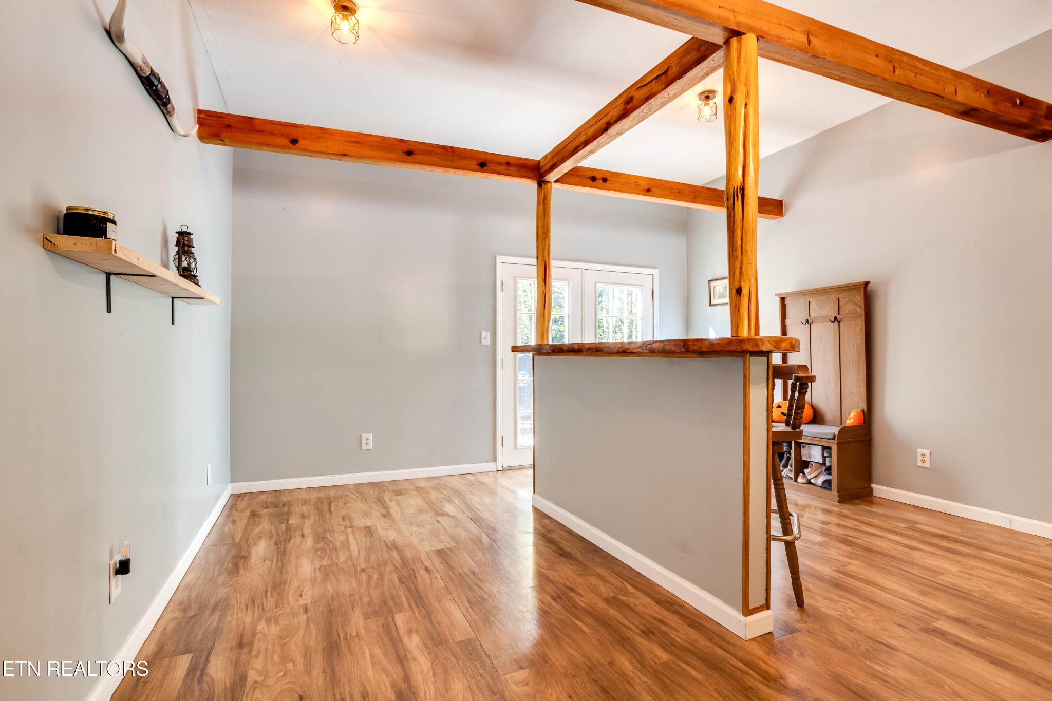 643 Airport Road Oakdale, TN 37829 - Photo 11 of 56 a view of a hallway with wooden floor and a bathroom
