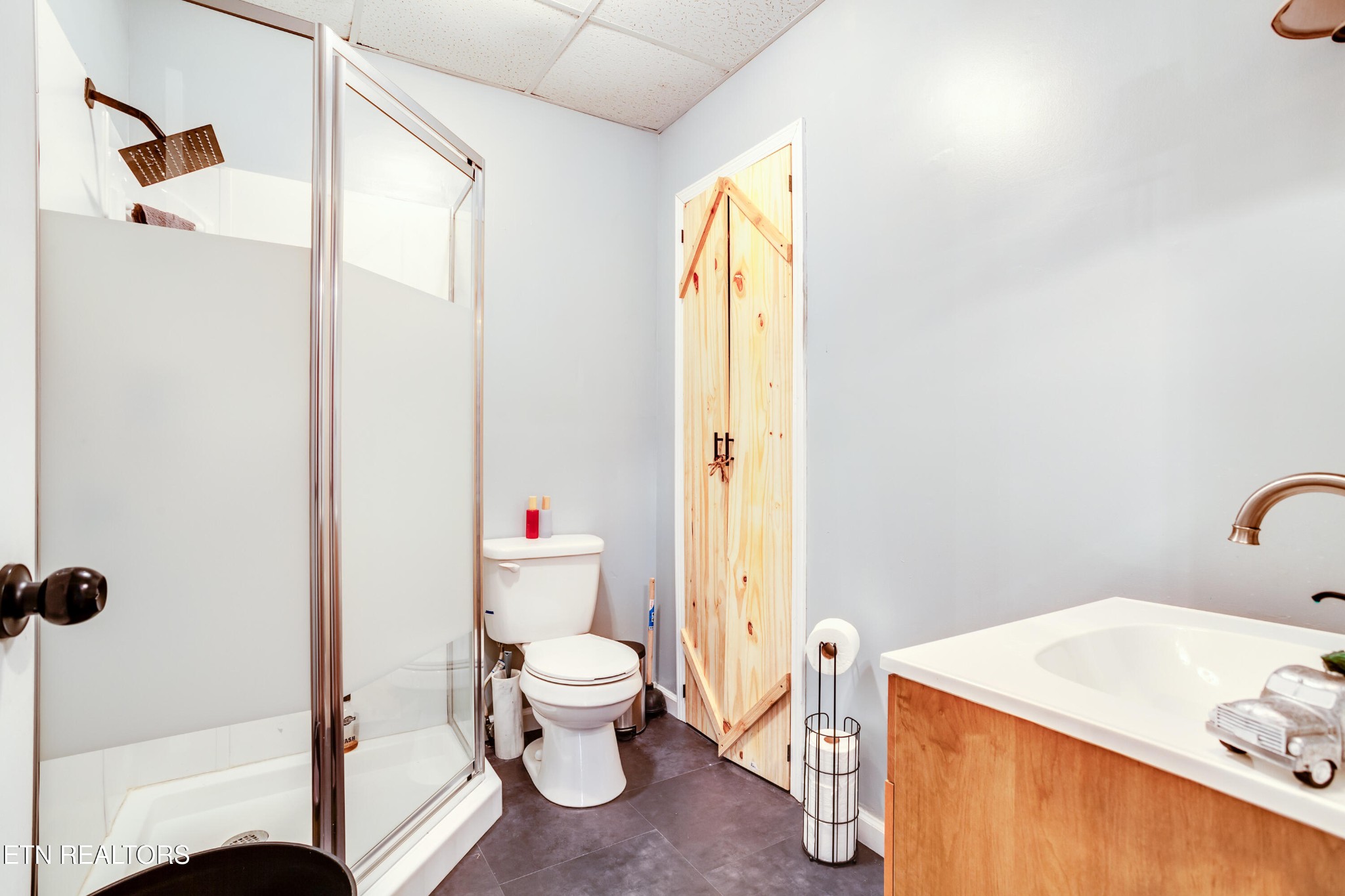 643 Airport Road Oakdale, TN 37829 - Photo 15 of 56 a bathroom with a sink and a mirror