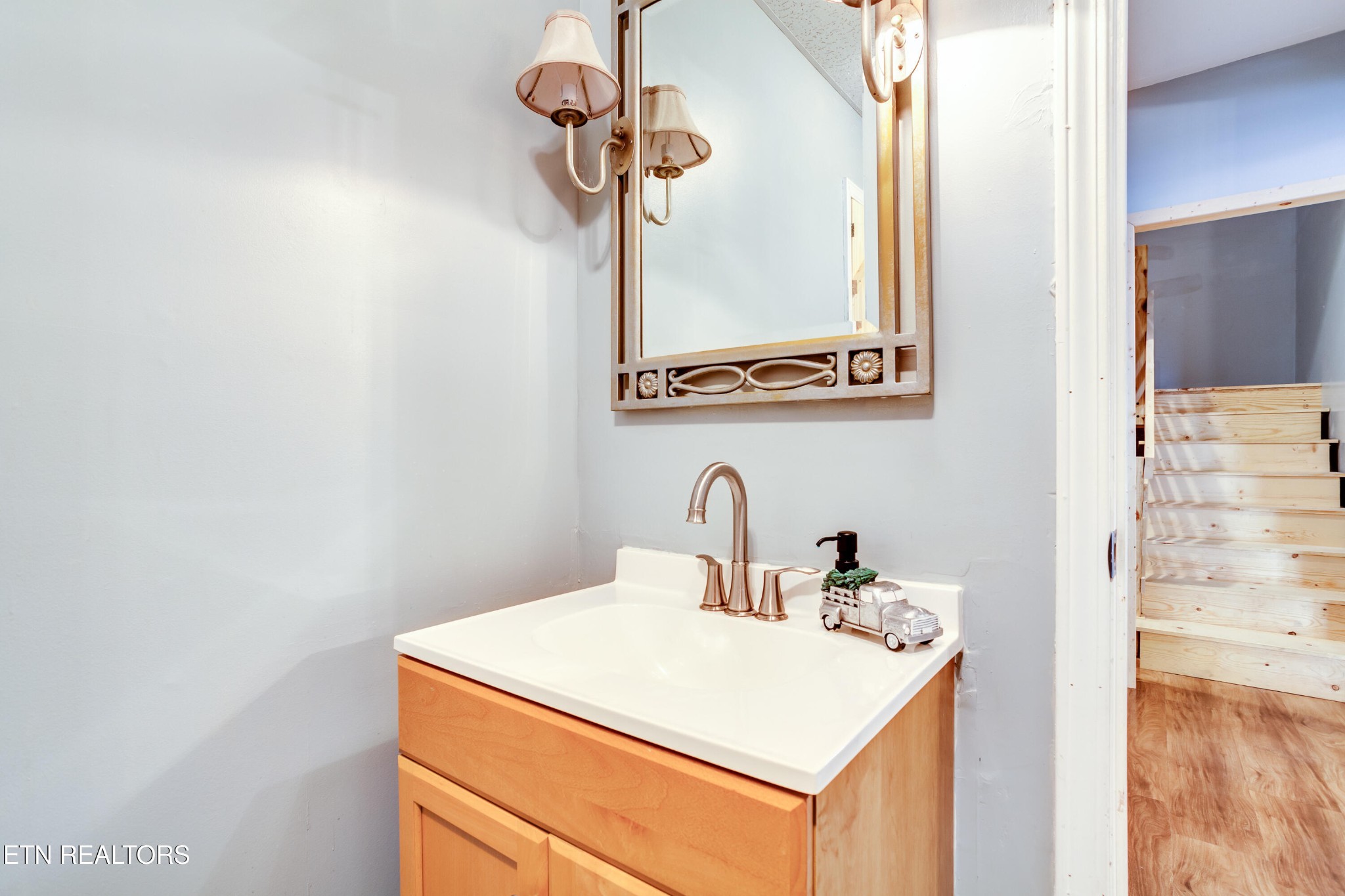 643 Airport Road Oakdale, TN 37829 - Photo 16 of 56 a bathroom with a sink a mirror and vanity