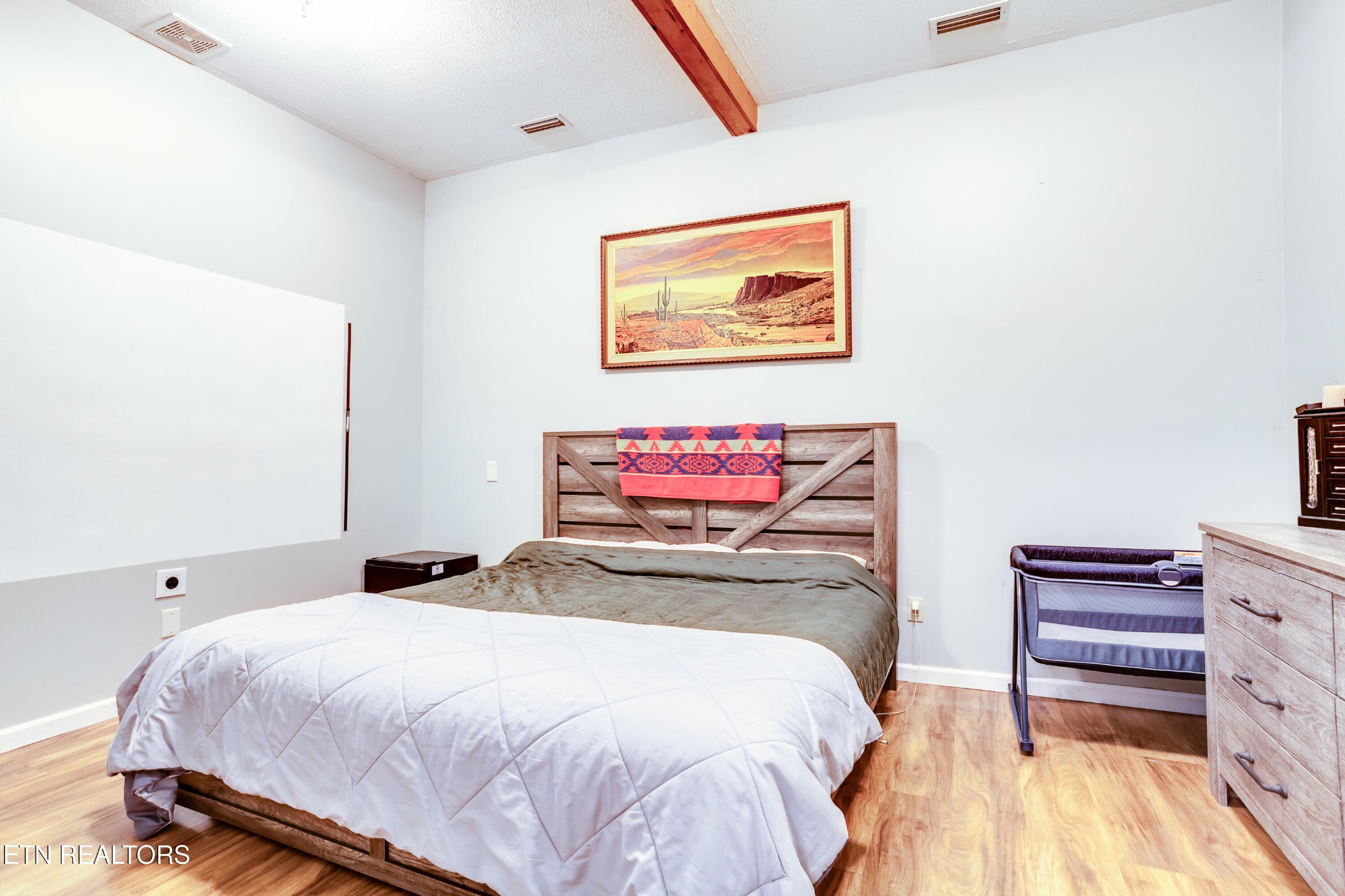 643 Airport Road Oakdale, TN 37829 - Photo 17 of 56 a bedroom with a bed and a dresser