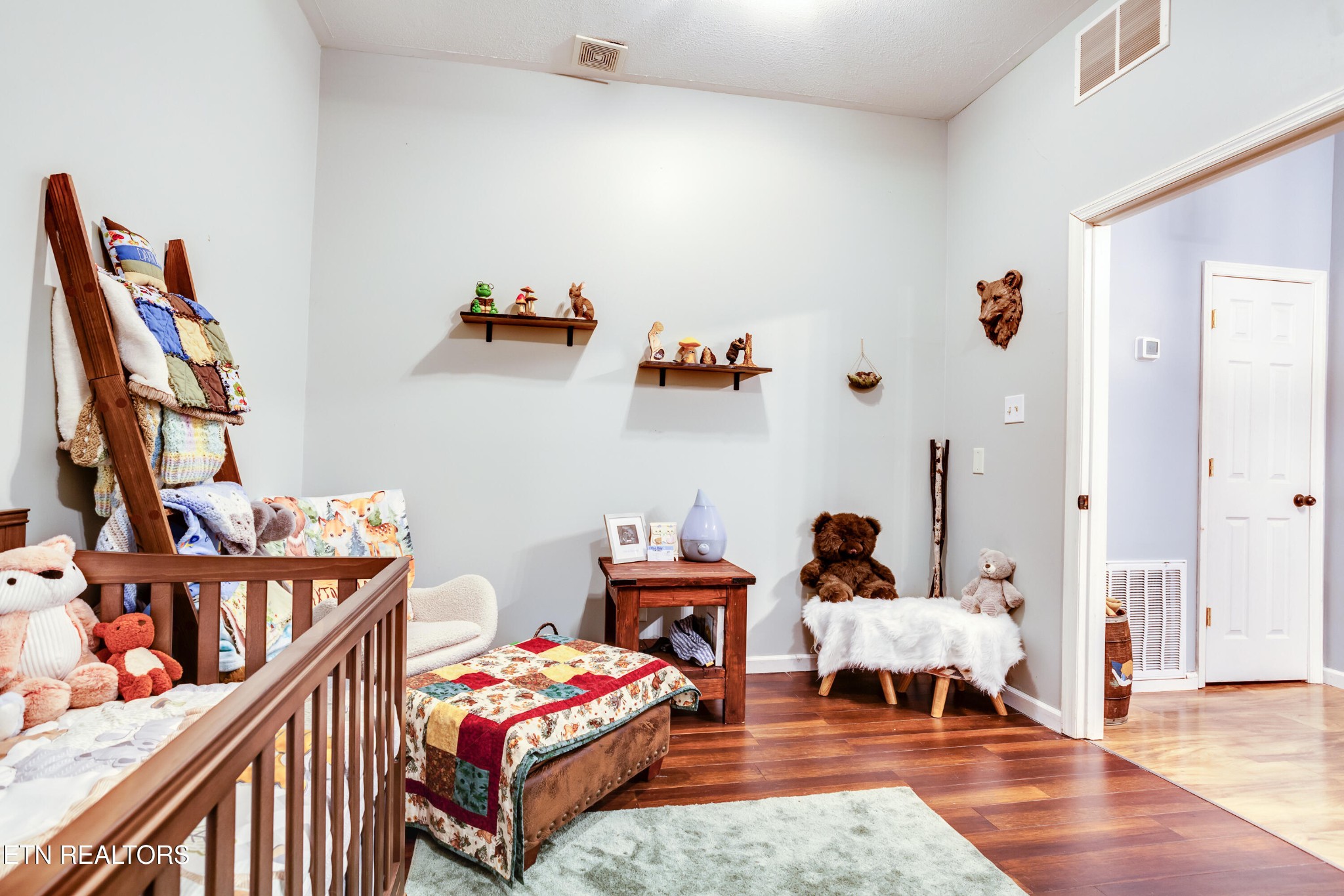 643 Airport Road Oakdale, TN 37829 - Photo 21 of 56 a bedroom with furniture and a wooden floor