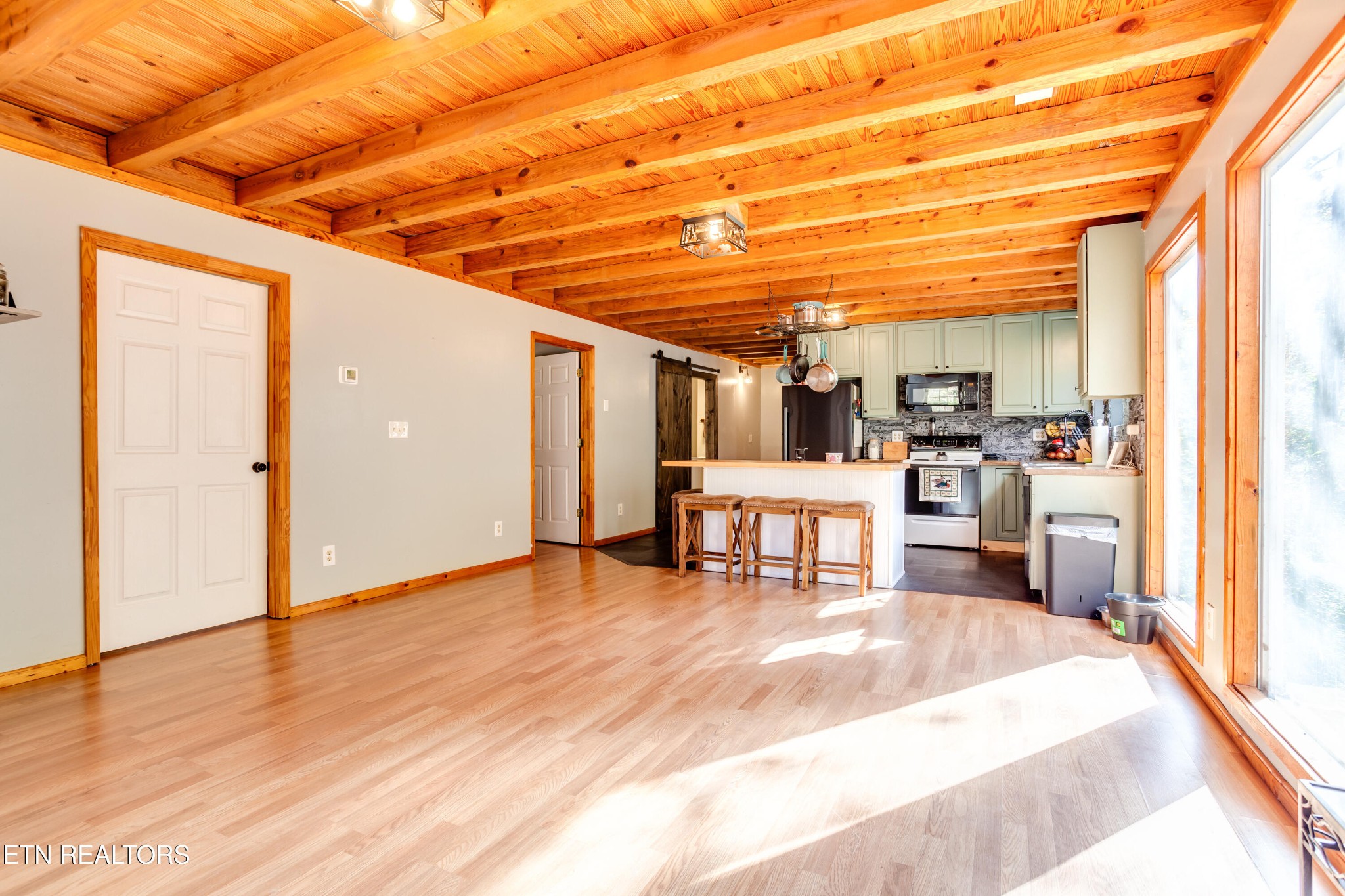 643 Airport Road Oakdale, TN 37829 - Photo 32 of 56 a view of kitchen with furniture and wooden floor