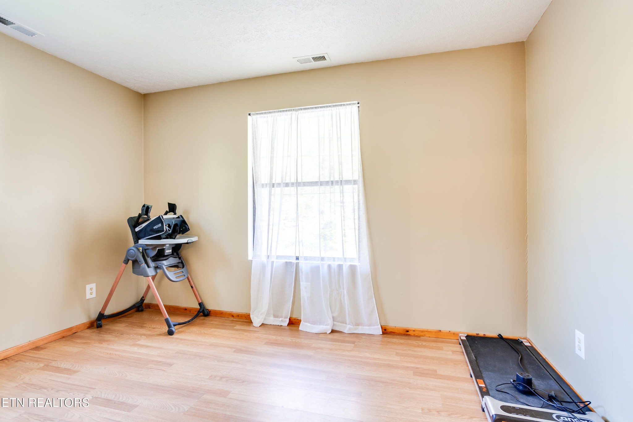 643 Airport Road Oakdale, TN 37829 - Photo 35 of 56 a room with gym equipment and a window