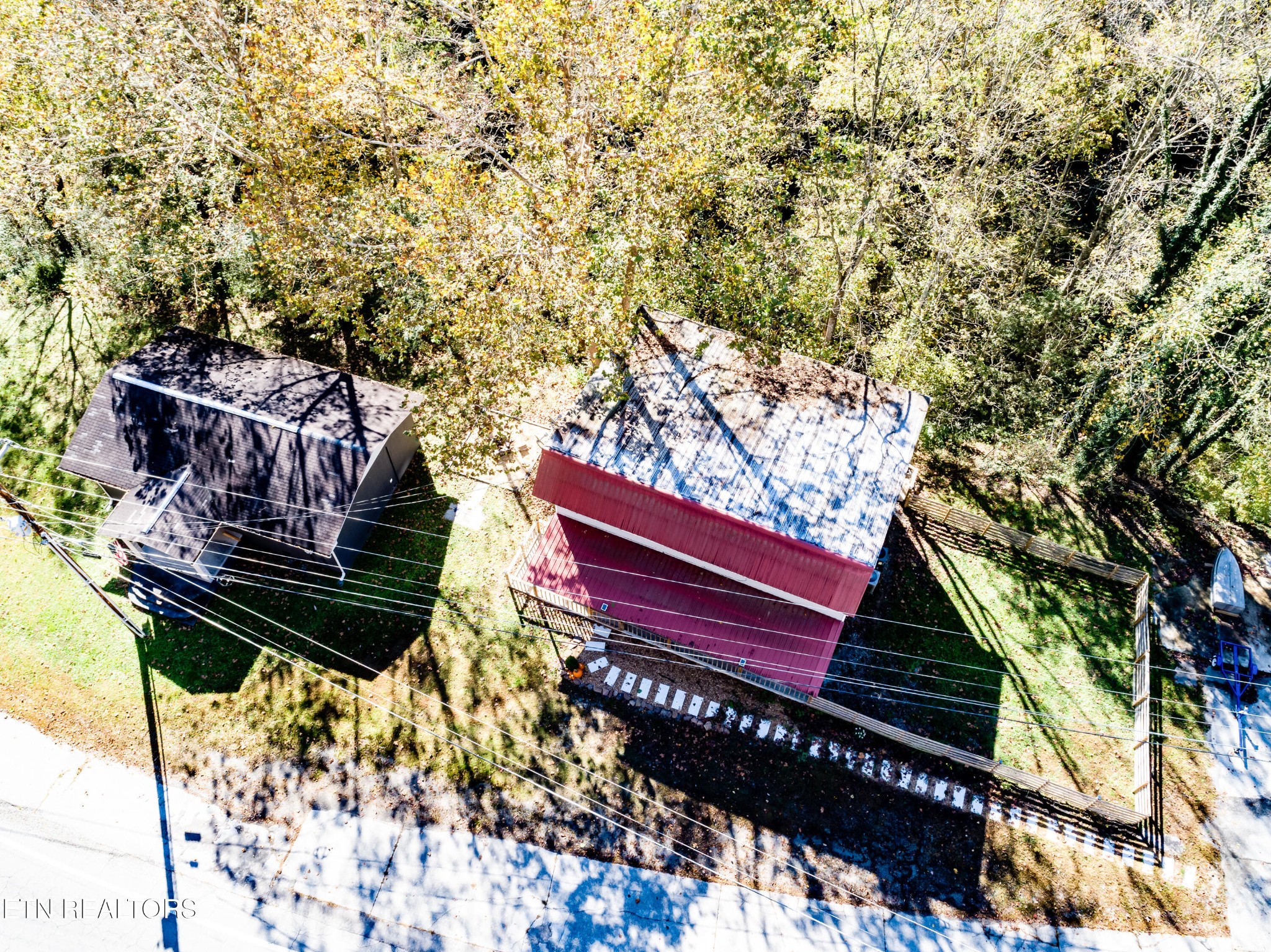 643 Airport Road Oakdale, TN 37829 - Photo 42 of 56 a view of a wooden bench in a back yard