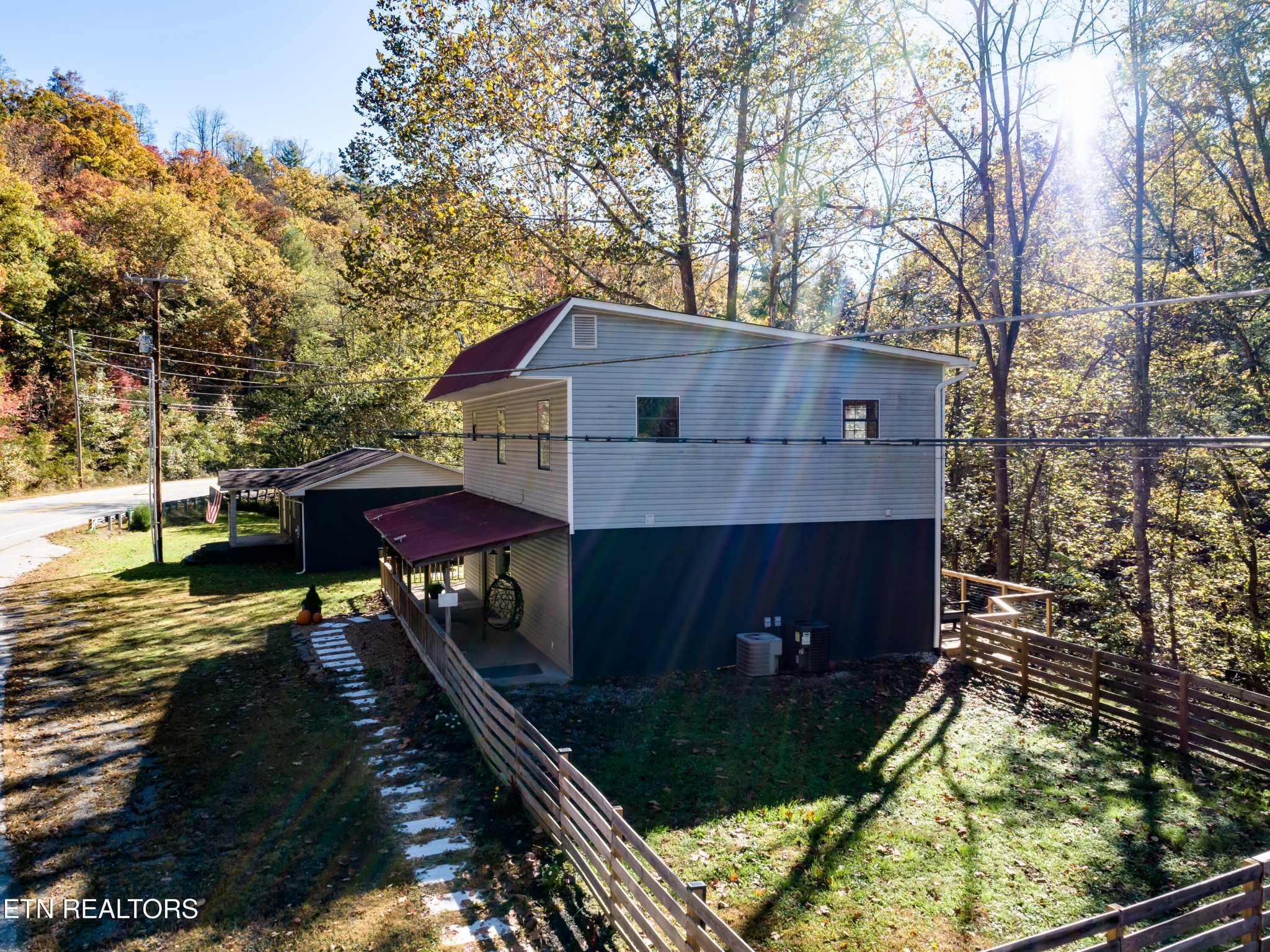643 Airport Road Oakdale, TN 37829 - Photo 47 of 56 a view of house with yard and sitting area