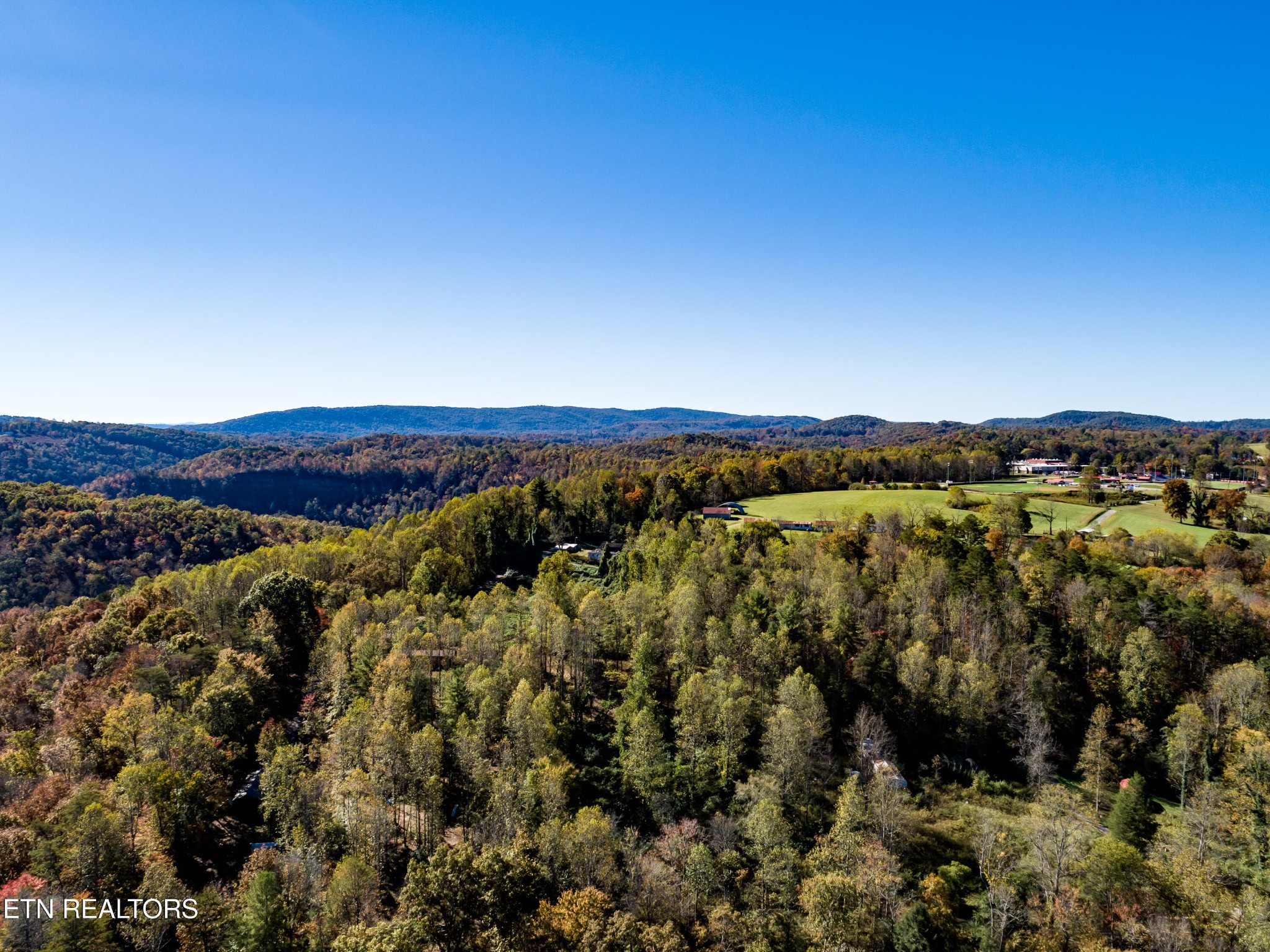 643 Airport Road Oakdale, TN 37829 - Photo 53 of 56 a view of a city with lush green forest