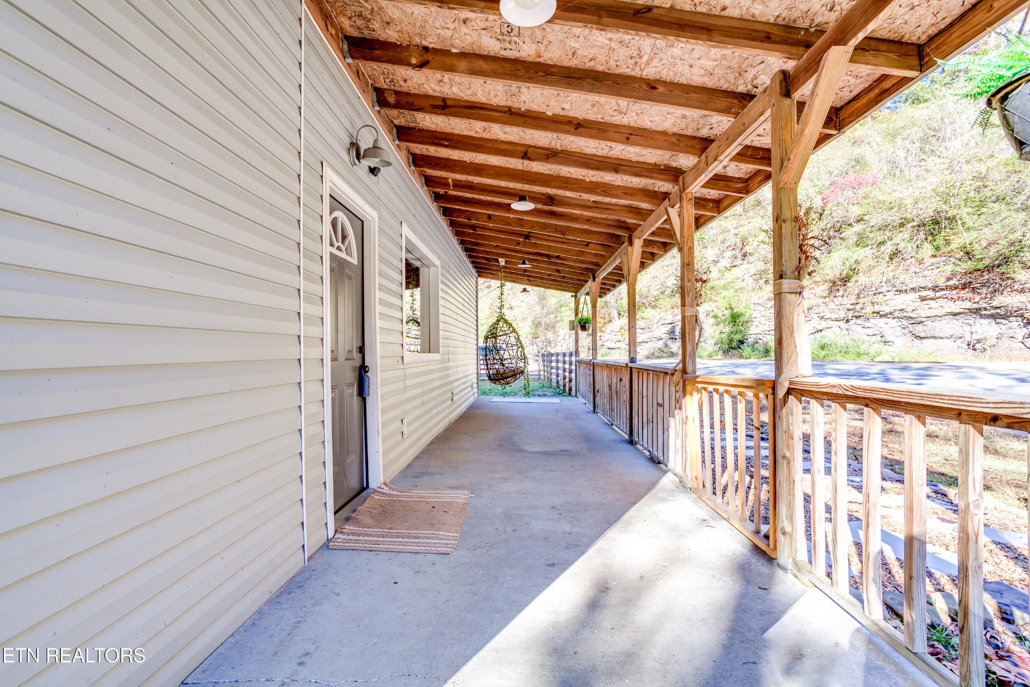 643 Airport Road Oakdale, TN 37829 - Photo 6 of 56 a view of porch with wooden floor