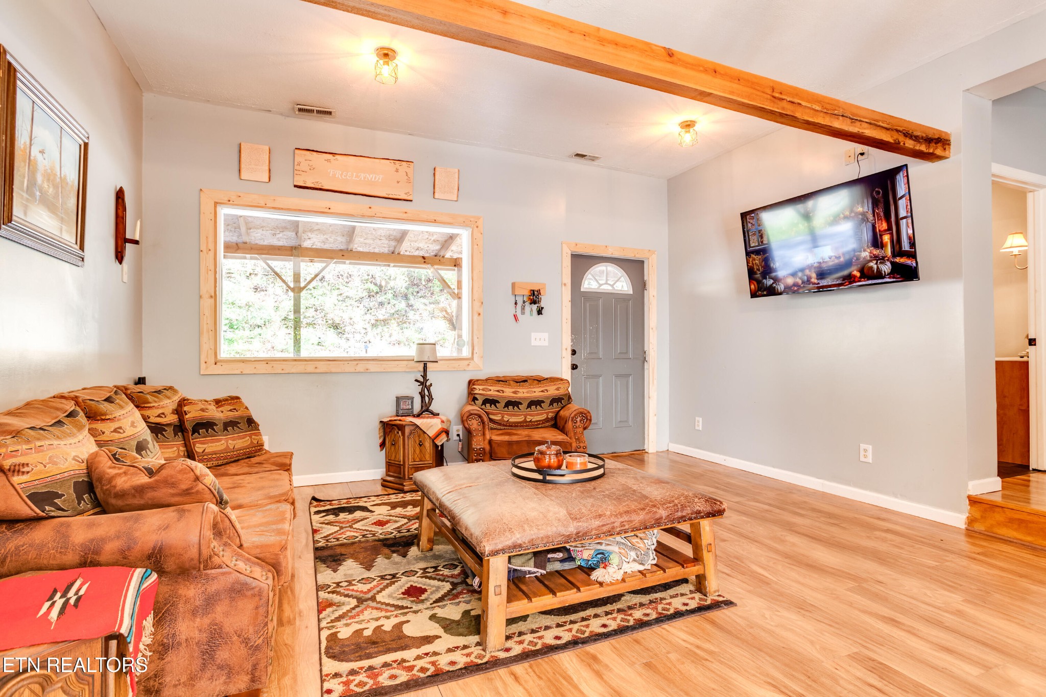 643 Airport Road Oakdale, TN 37829 - Photo 10 of 56 a living room with a bed furniture and a window
