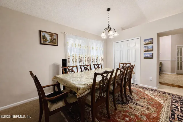 a view of a dining room and a livingroom