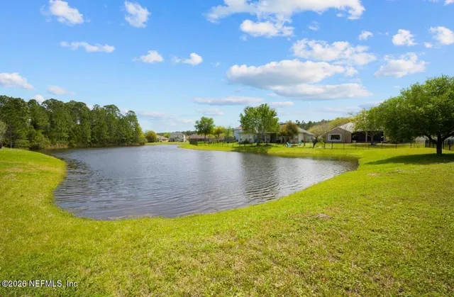 a view of a lake with a yard