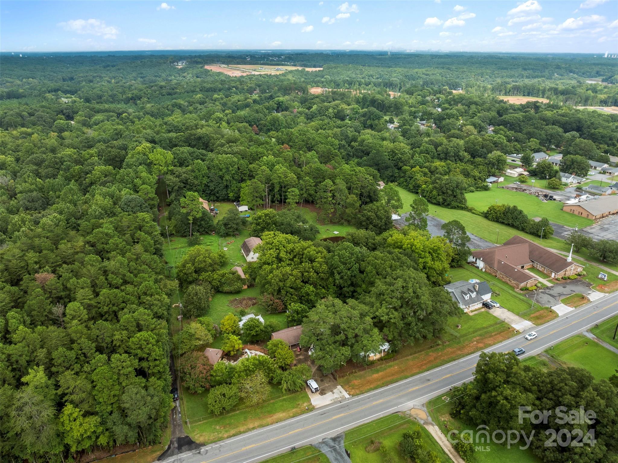 4539 South New Hope Road Belmont, NC 28012 - Photo 15 of 26 an aerial view of residential houses with outdoor space and trees