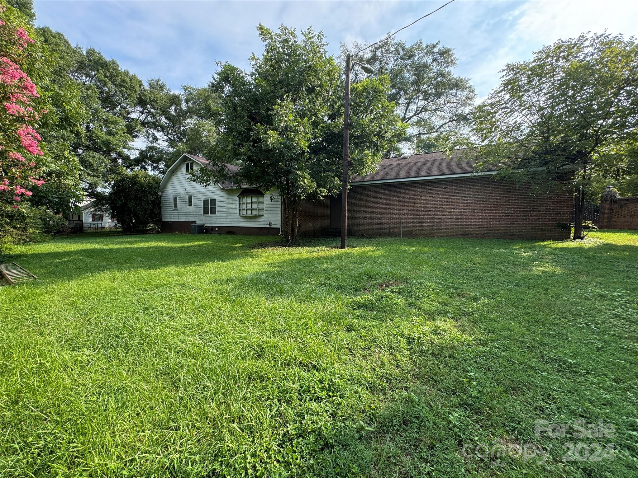 4539 South New Hope Road Belmont, NC 28012 - Photo 18 of 26 a house view with a garden space