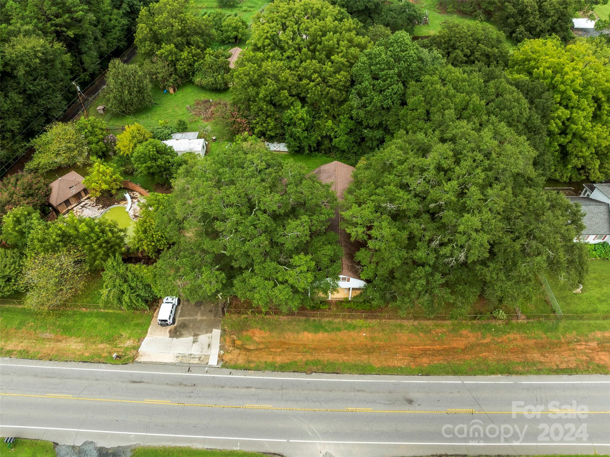 4539 South New Hope Road Belmont, NC 28012 - Photo 4 of 26 a view of a yard house and street