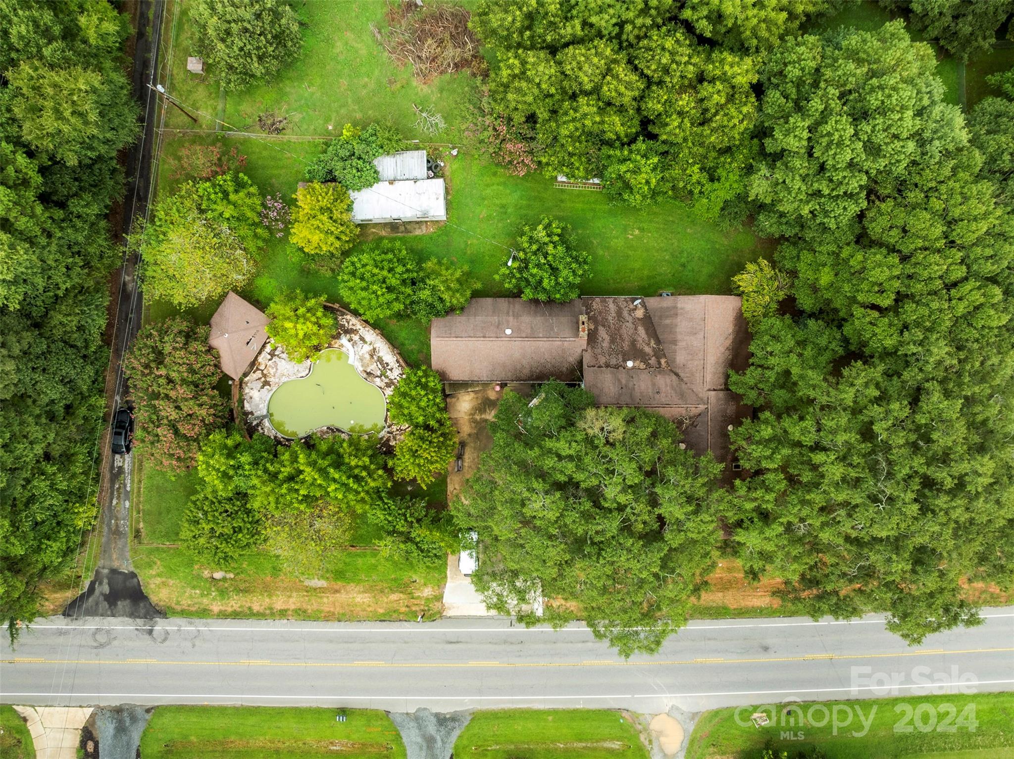 4539 South New Hope Road Belmont, NC 28012 - Photo 6 of 26 an aerial view of a house with a yard basket ball court and outdoor seating
