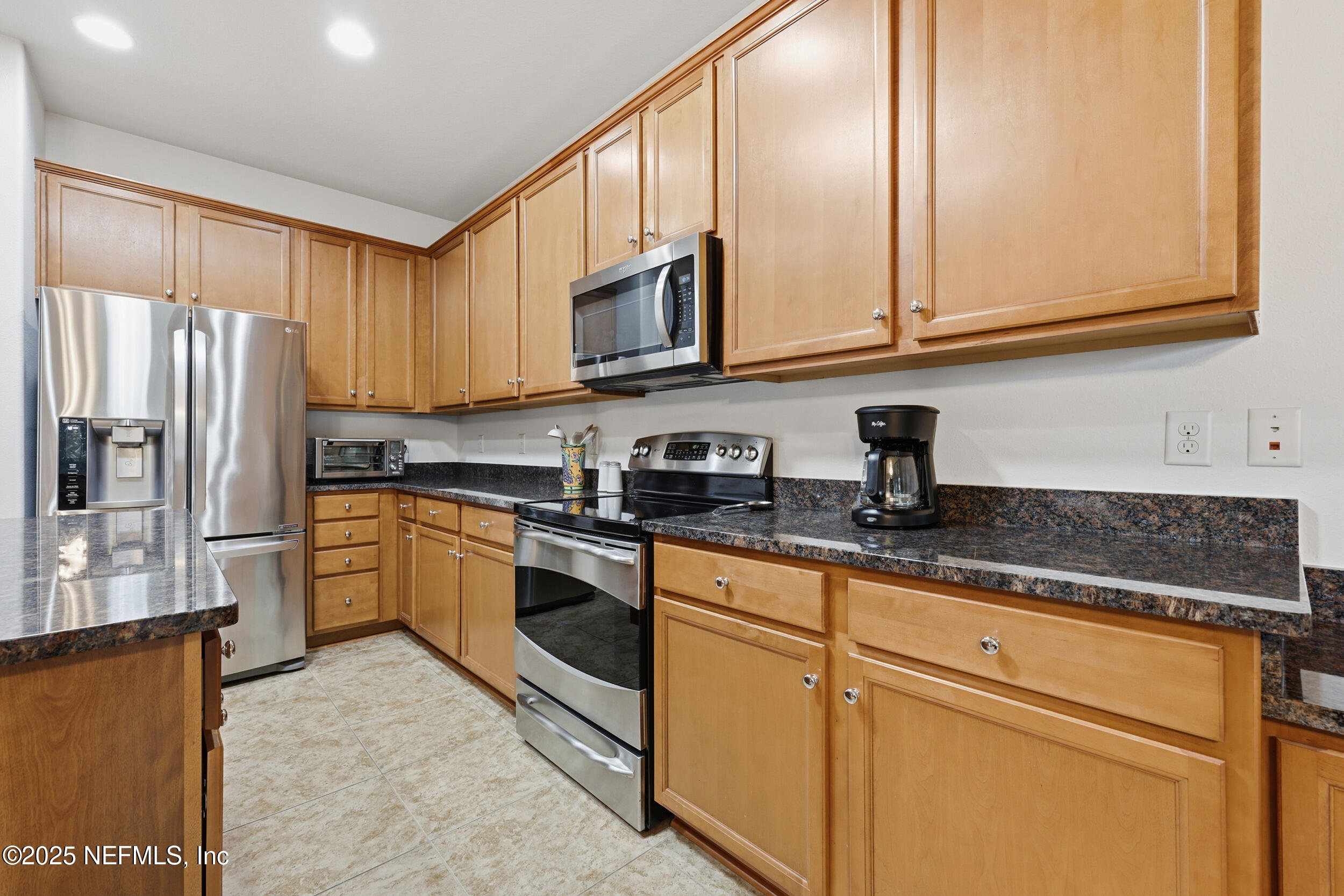 653 River Run Boulevard Ponte Vedra, FL 32081 - Photo 13 of 130 a kitchen with stainless steel appliances granite countertop a refrigerator sink and stove
