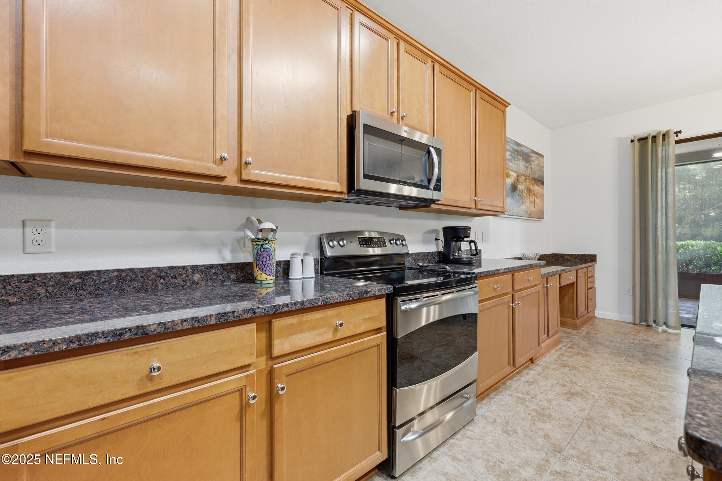 653 River Run Boulevard Ponte Vedra, FL 32081 - Photo 15 of 130 a kitchen with granite countertop white cabinets stainless steel appliances and a counter space