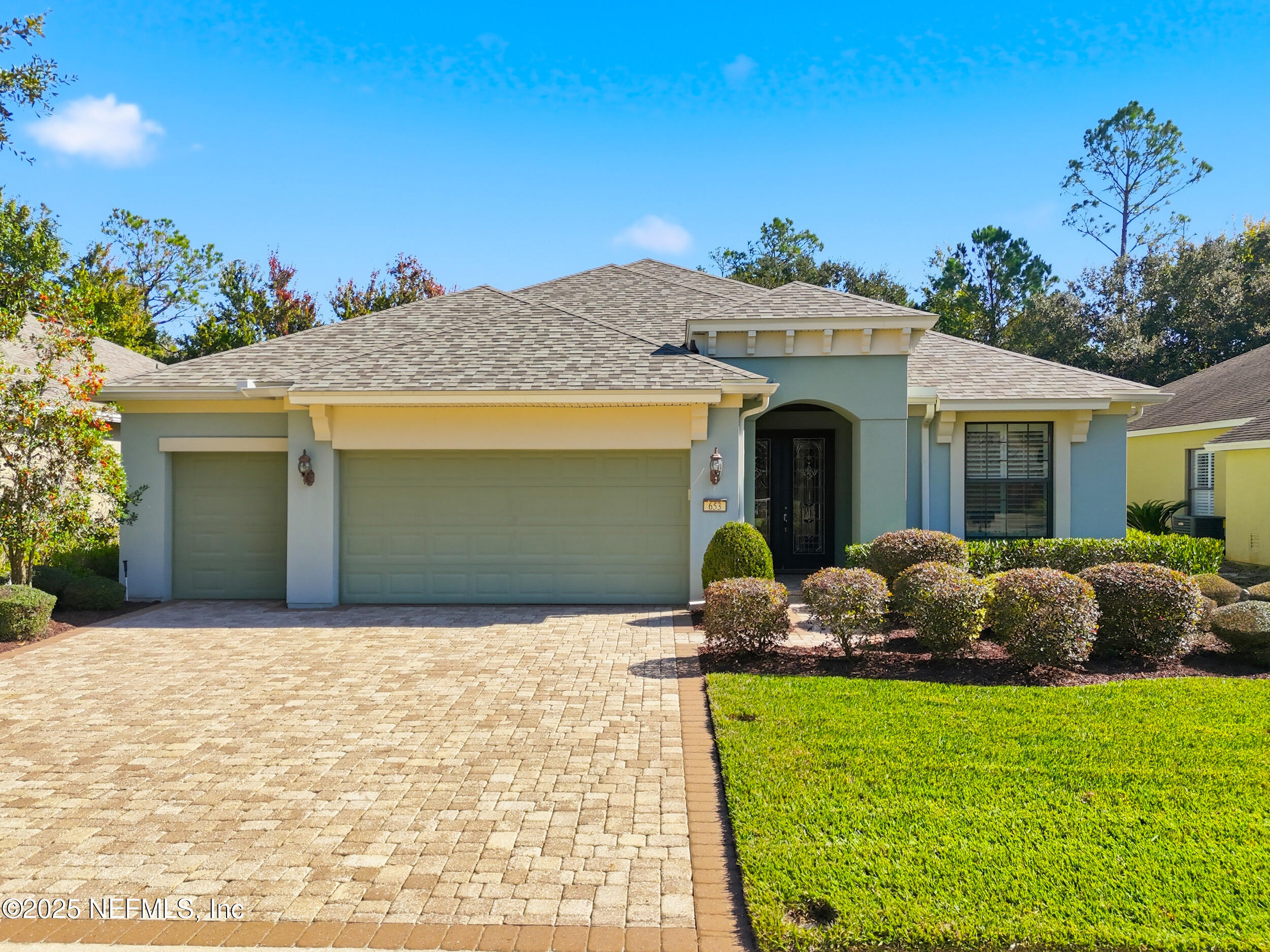 653 River Run Boulevard Ponte Vedra, FL 32081 - Photo 2 of 130 a front view of a house with a garden and plants