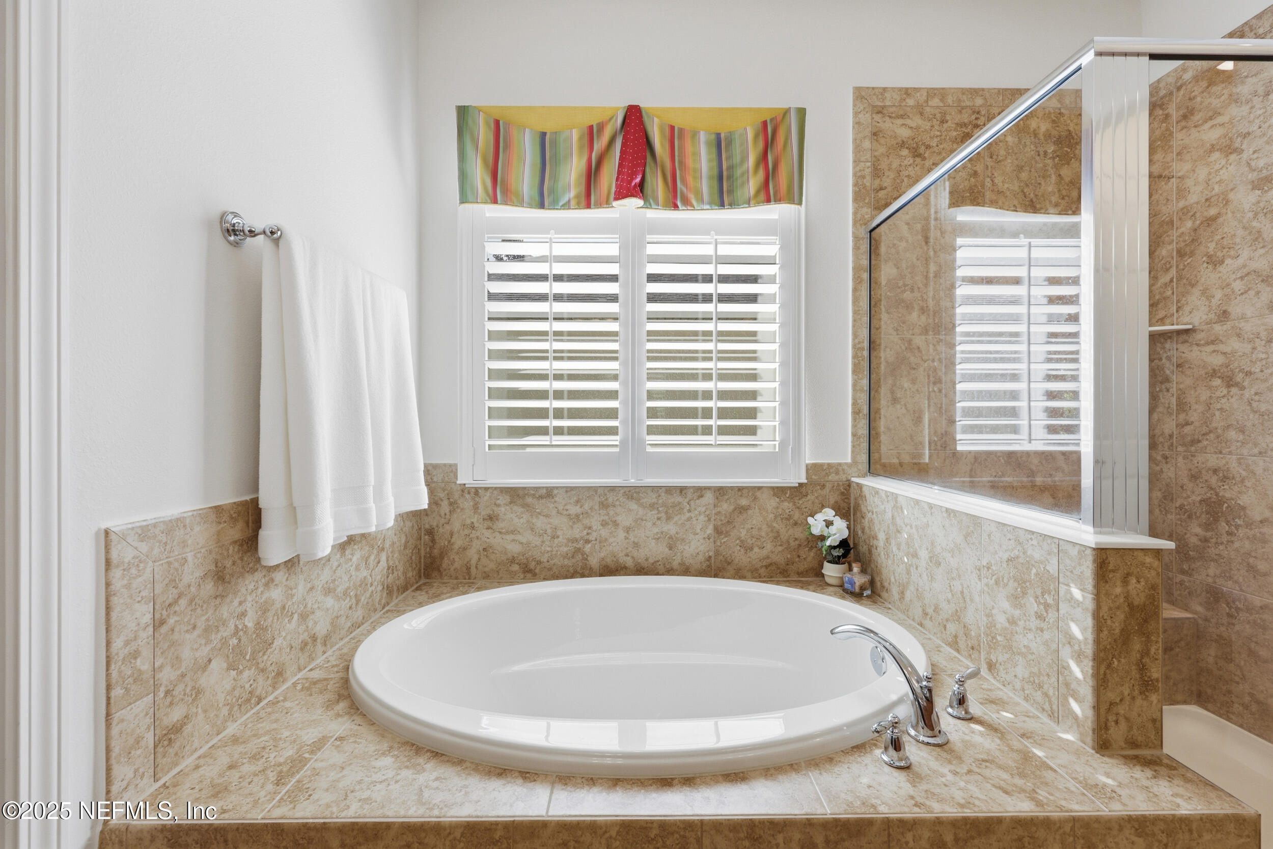 653 River Run Boulevard Ponte Vedra, FL 32081 - Photo 27 of 130 a bathroom with a bathtub and a window