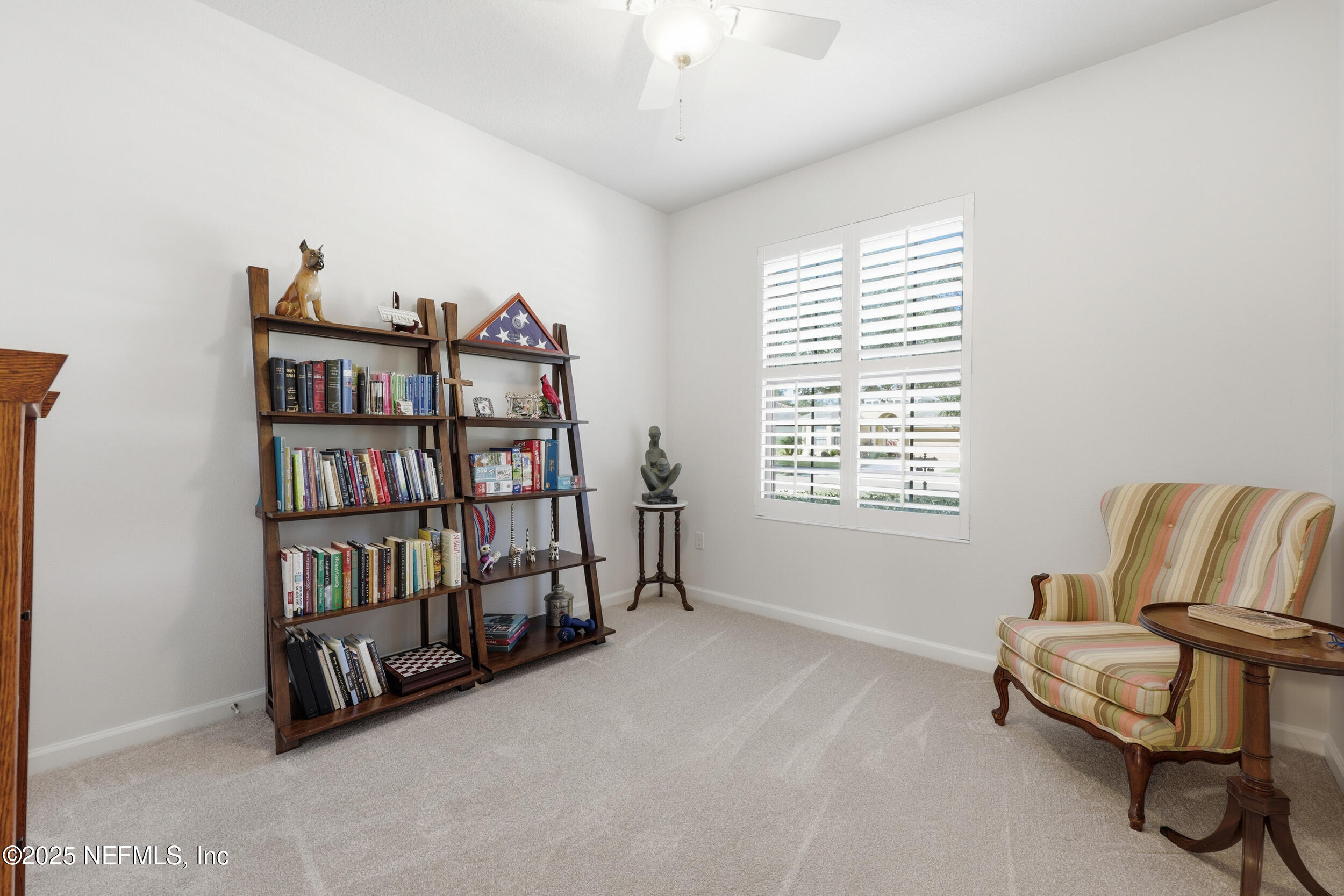 653 River Run Boulevard Ponte Vedra, FL 32081 - Photo 29 of 130 a living room with furniture a book shelf and a window