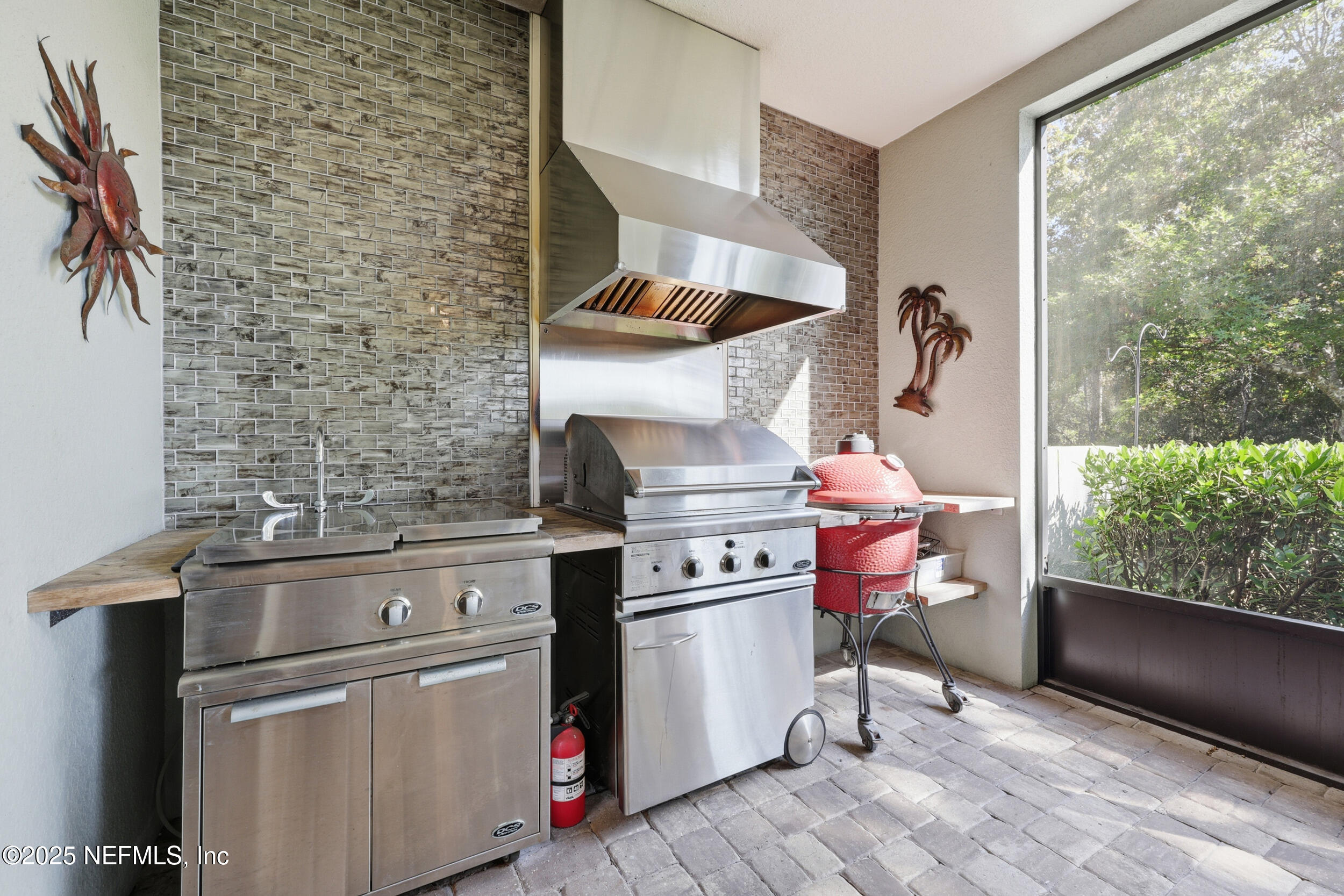 653 River Run Boulevard Ponte Vedra, FL 32081 - Photo 43 of 130 a kitchen with stainless steel appliances and wooden cabinets