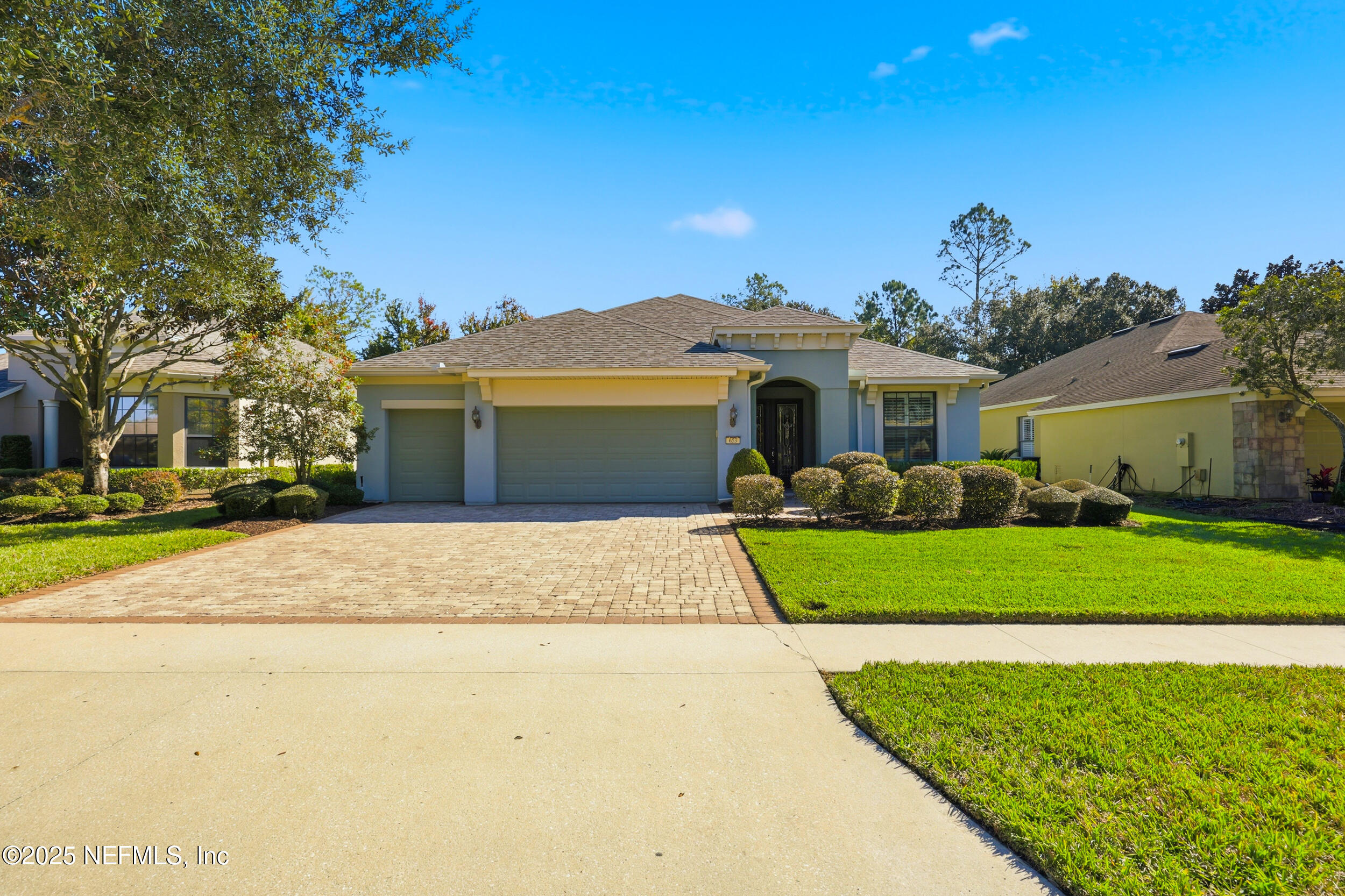 653 River Run Boulevard Ponte Vedra, FL 32081 - Photo 50 of 130 a front view of a house with a yard and garage
