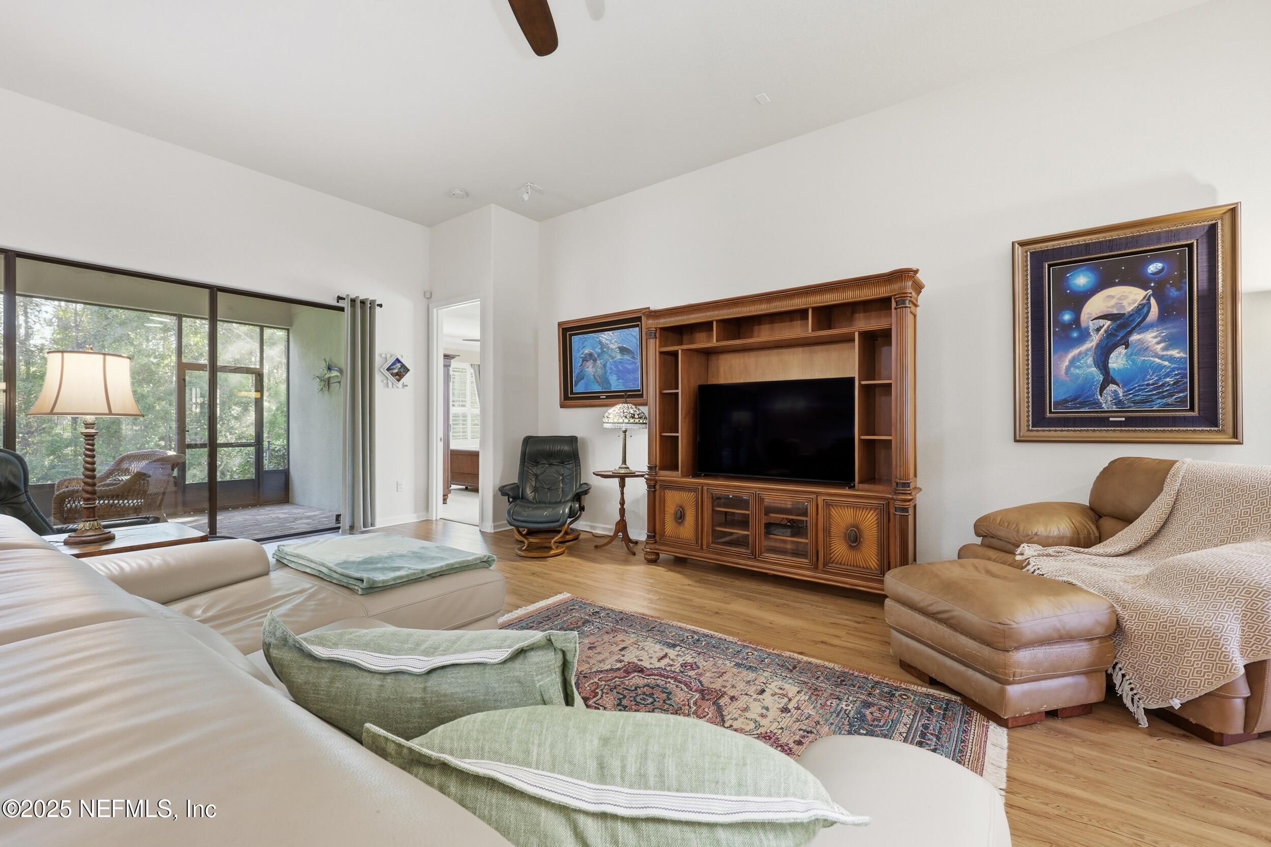 653 River Run Boulevard Ponte Vedra, FL 32081 - Photo 7 of 130 a living room with furniture and a flat screen tv