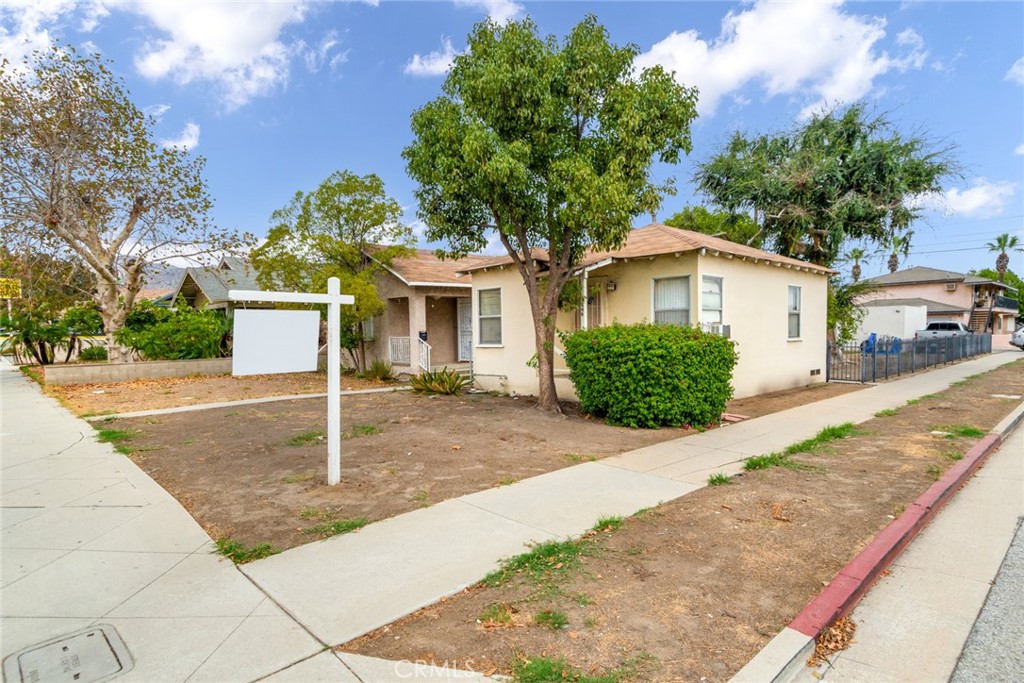 500 North Azusa Avenue Azusa, CA 91702 - Photo 1 of 1 a front view of a house with a yard and garage