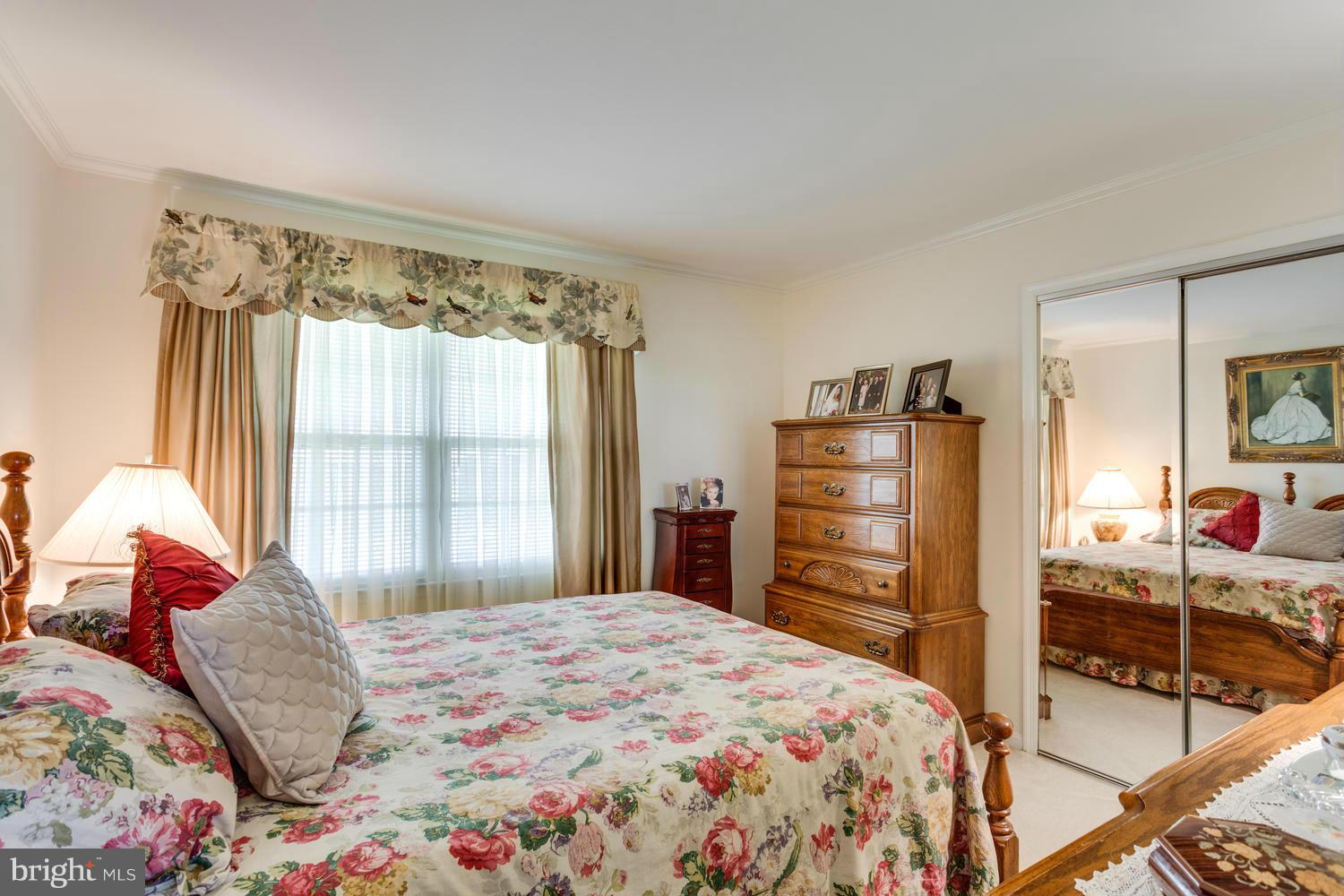 11611 Vale Road Oakton, VA 22124 - Photo 14 of 30 a bedroom with a bed and a dresser