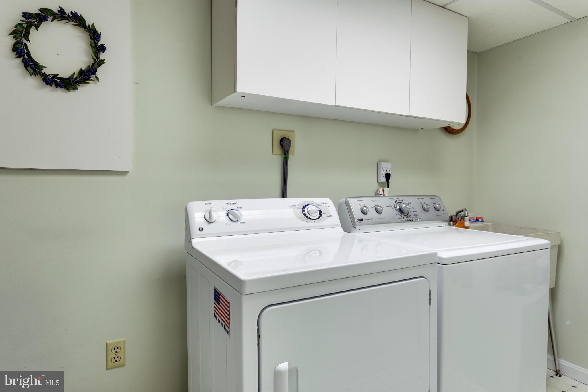 11611 Vale Road Oakton, VA 22124 - Photo 22 of 30 a utility room with dryer and washer