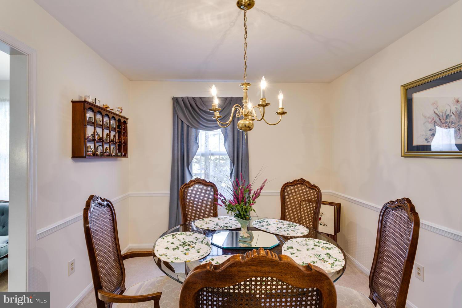 11611 Vale Road Oakton, VA 22124 - Photo 4 of 30 a view of a dining room with furniture