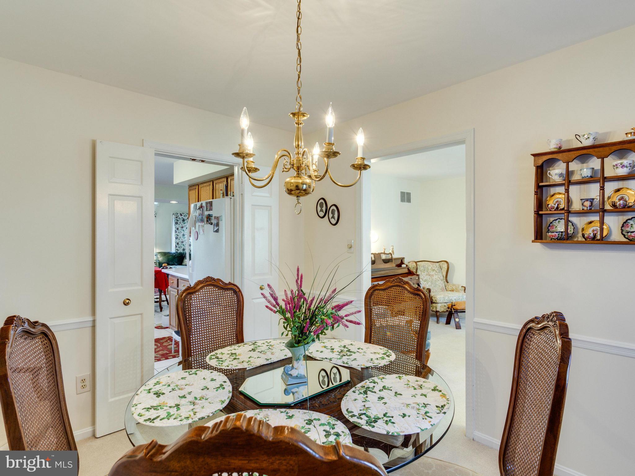 11611 Vale Road Oakton, VA 22124 - Photo 5 of 30 a dining room with furniture and wooden floor
