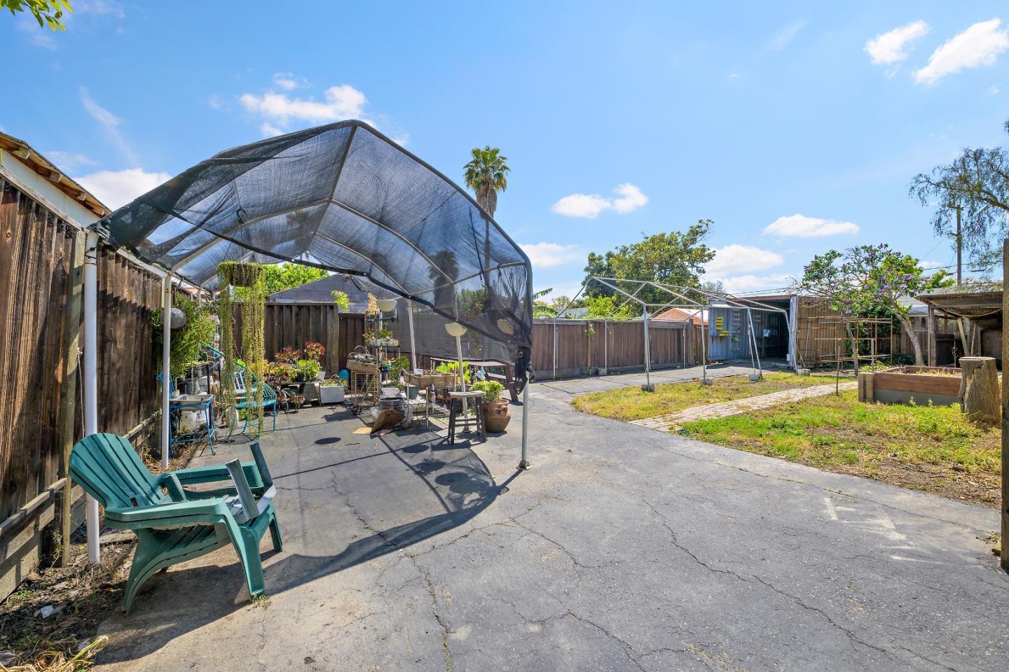 310 Lewis Road San Jose, CA 95111 - Photo 14 of 27 a view of a chairs and table in backyard