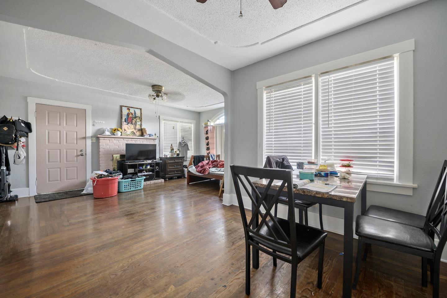 310 Lewis Road San Jose, CA 95111 - Photo 3 of 27 a dining room with furniture and wooden floor