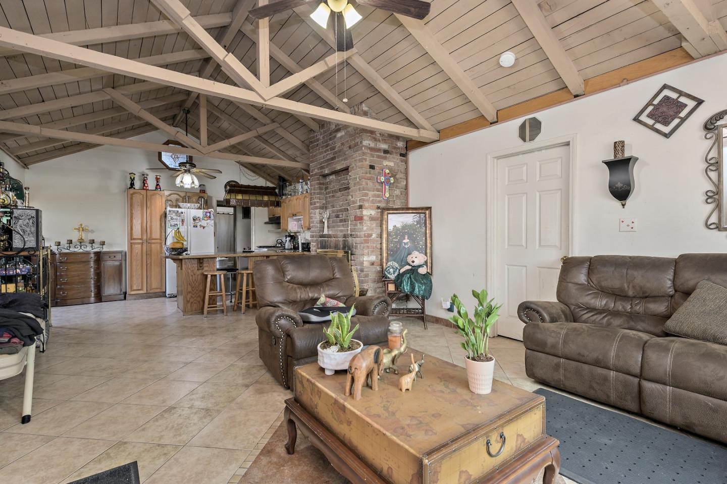 310 Lewis Road San Jose, CA 95111 - Photo 4 of 27 a living room with furniture and kitchen view