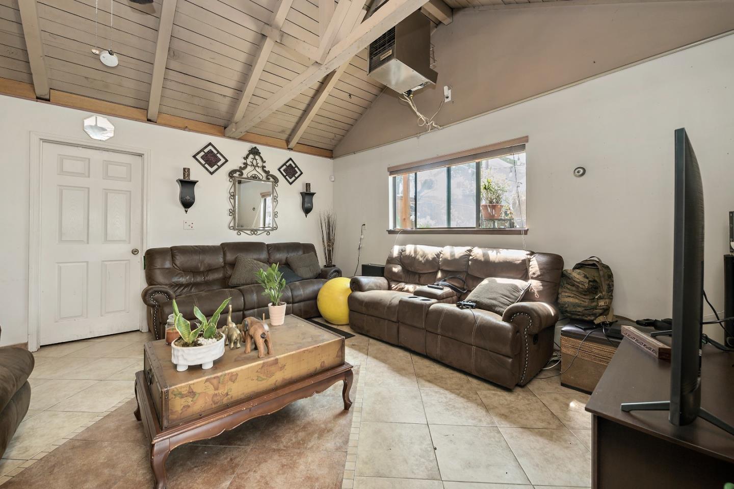 310 Lewis Road San Jose, CA 95111 - Photo 5 of 27 a living room with furniture and a chandelier