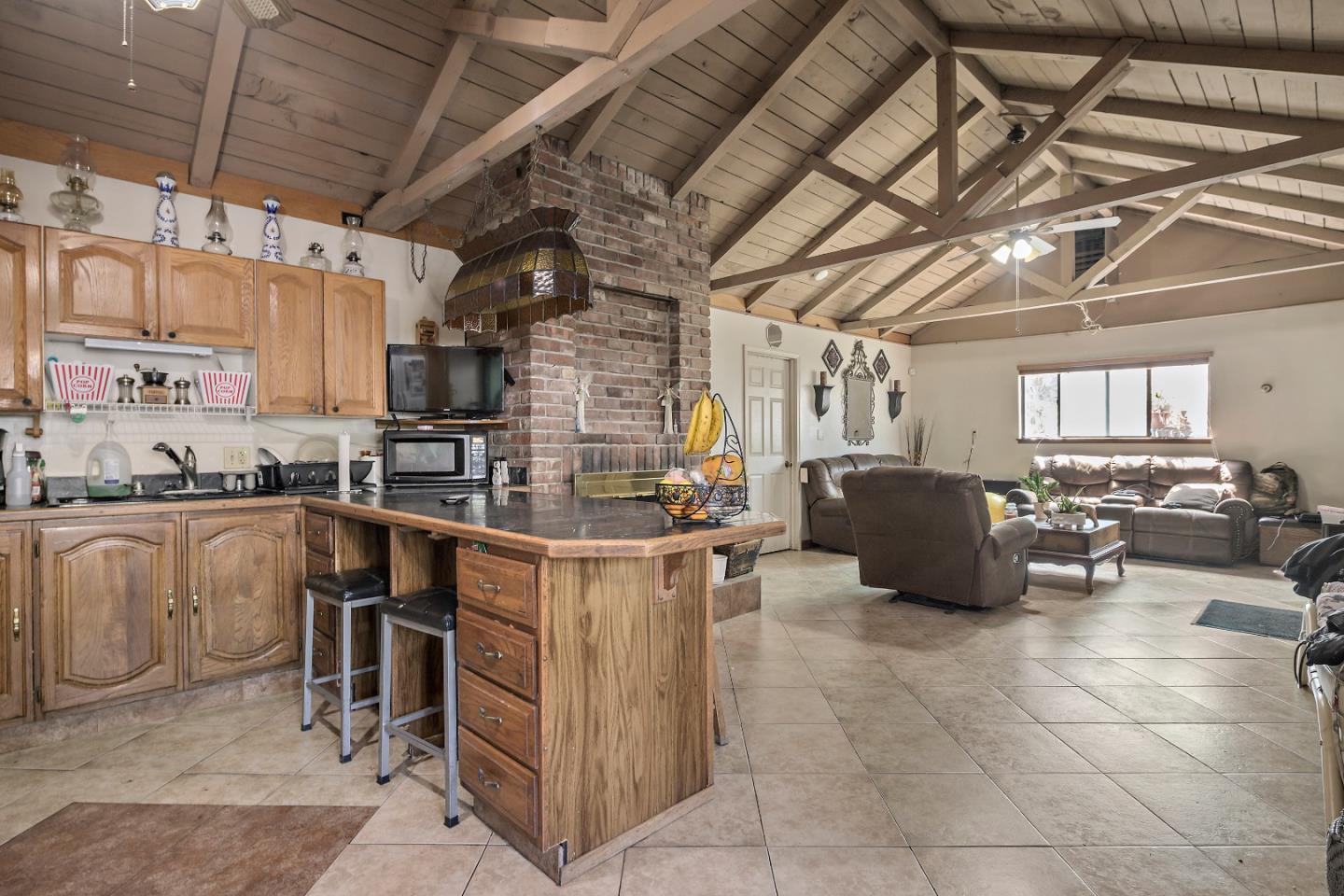 310 Lewis Road San Jose, CA 95111 - Photo 7 of 27 a kitchen with kitchen island granite countertop lots of counter top space
