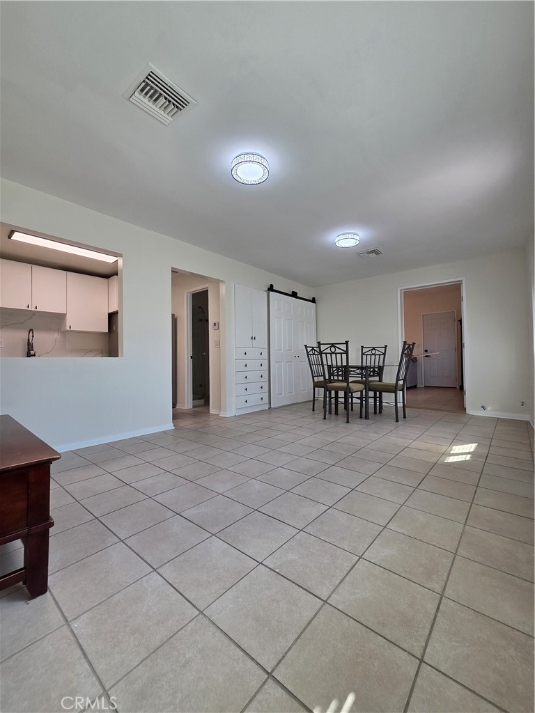 6956 Wystone Avenue, Unit B Reseda, CA 91335 - Photo 2 of 9 Living room with pass-through to kitchen.