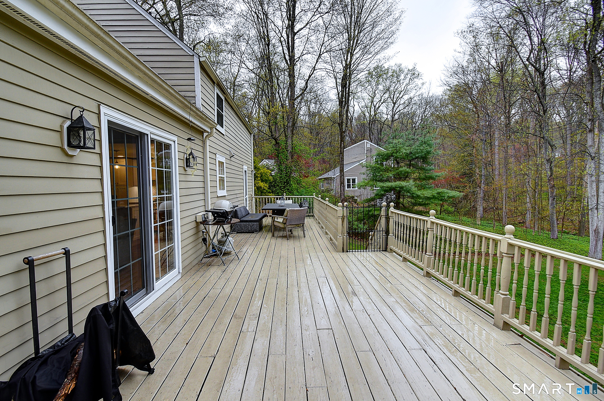 27 Chestnut Hill Road Newtown, CT 06482 - Photo 11 of 36 a view of balcony with chairs and wooden floor
