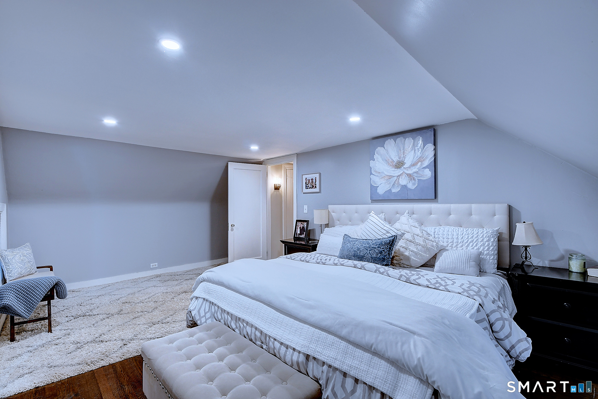 27 Chestnut Hill Road Newtown, CT 06482 - Photo 27 of 36 a spacious bedroom with a bed and chair