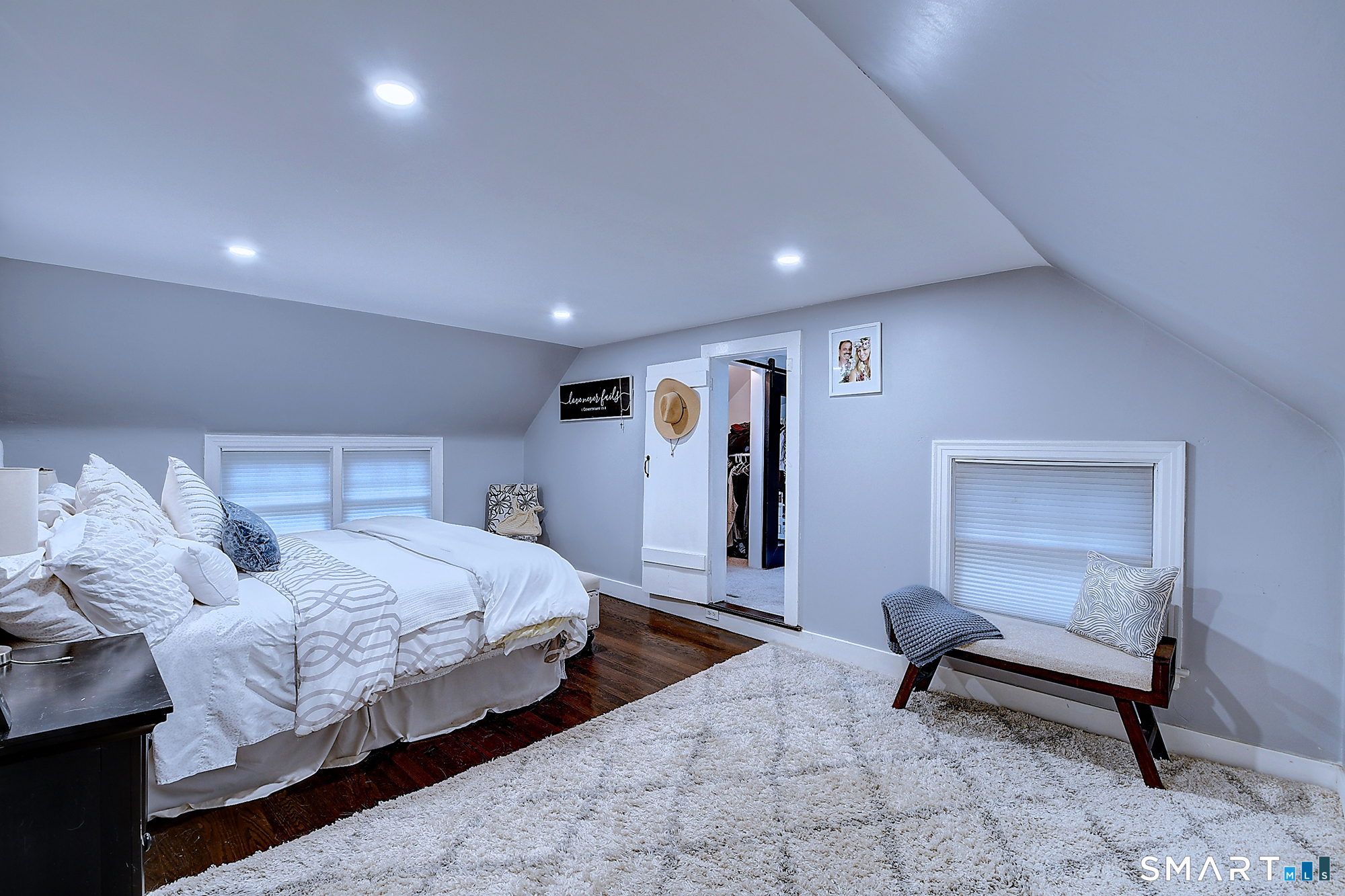 27 Chestnut Hill Road Newtown, CT 06482 - Photo 28 of 36 a spacious bedroom with a bed and a lamp