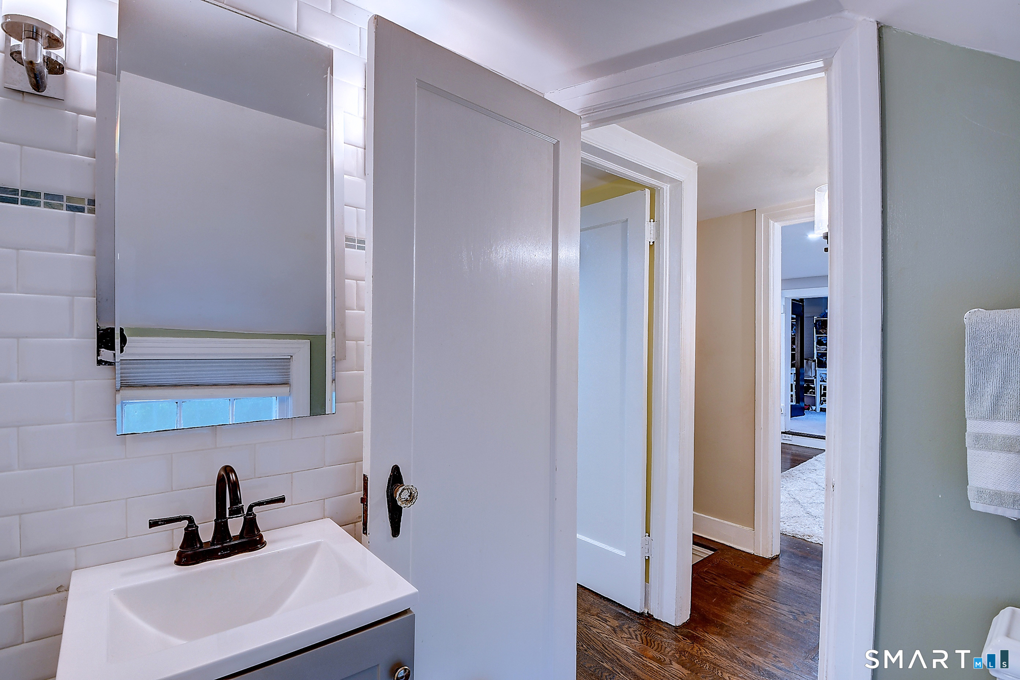27 Chestnut Hill Road Newtown, CT 06482 - Photo 34 of 36 a bathroom with a sink and a mirror