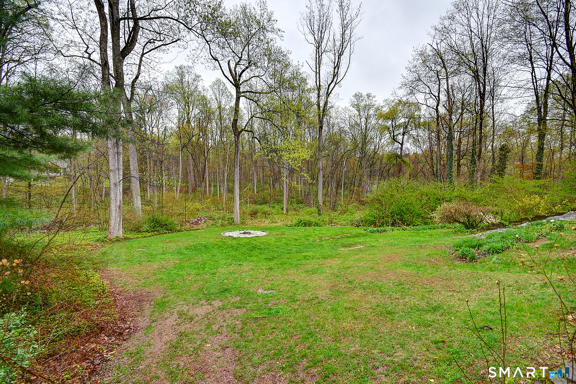 27 Chestnut Hill Road Newtown, CT 06482 - Photo 7 of 36 a view of backyard with green space