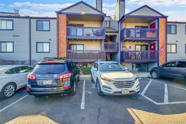 a car parked in front of a brick building