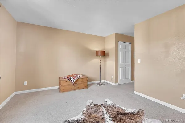a bedroom with a bed and a cabinets