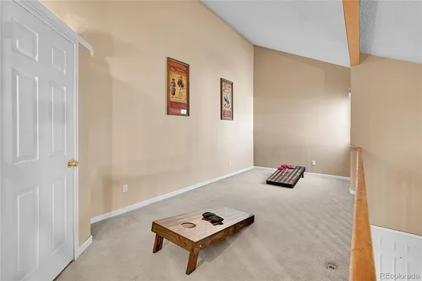 a living room with furniture and next to a window