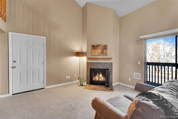a bedroom with a bed and a fireplace