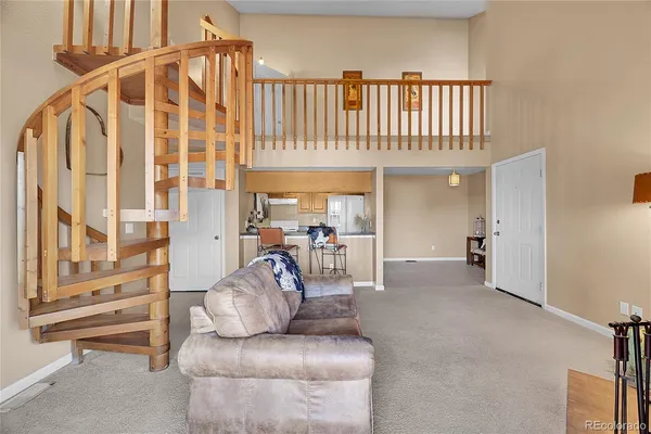 a view of a furniture and a livingroom with furniture