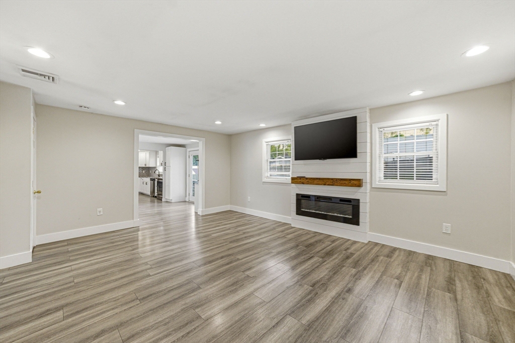 157 Errol Road Brockton, MA 02302 - Photo 21 of 34 a view of empty room with wooden floor and window