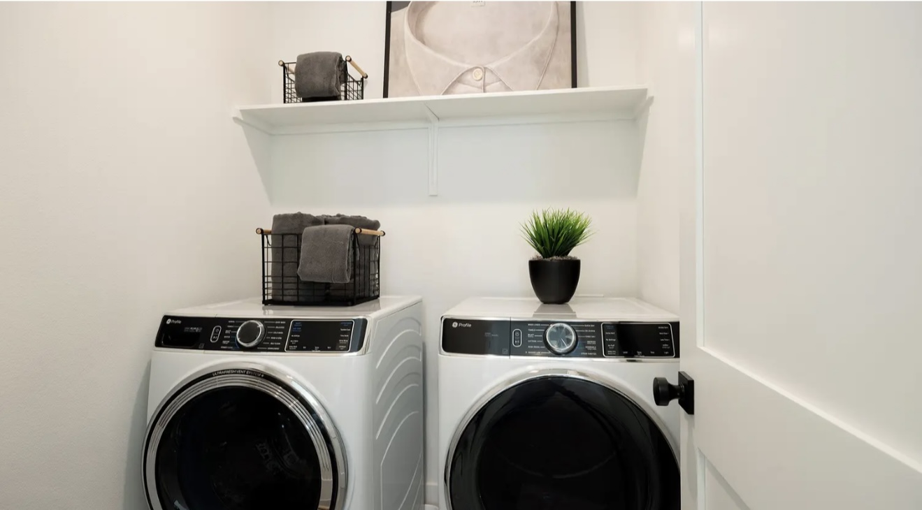 1405 Sweet Bark Street Austin, TX 78745 - Photo 11 of 11 a utility room with dryer and washer